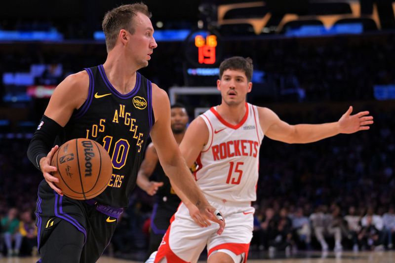 Apr 21, 2026; Los Angeles, California, USA; Los Angeles Lakers guard Luke Kennard (10) is defended by Houston Rockets guard Reed Sheppard (15) in the first half of game two of the first round of the 2026 NBA Playoffs at Crypto.com Arena. Mandatory Credit: Jayne Kamin-Oncea-Imagn Images