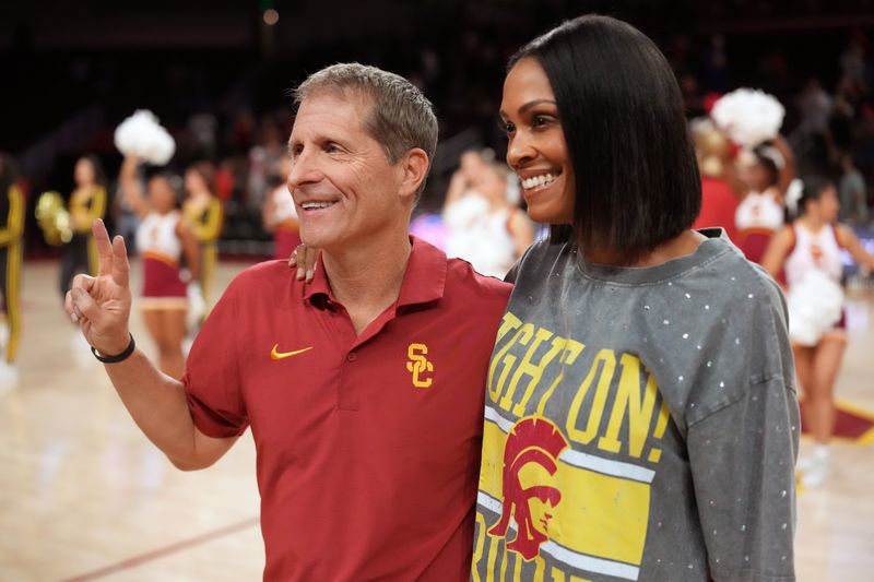 Jan 31, 2026; Los Angeles, California, USA; Southern California Trojans head coach Eric Musselman (left) poses with wife Danyelle Musselman after the game against the Rutgers Scarlet Knights at Galen Center. Mandatory Credit: Kirby Lee-Imagn Images
