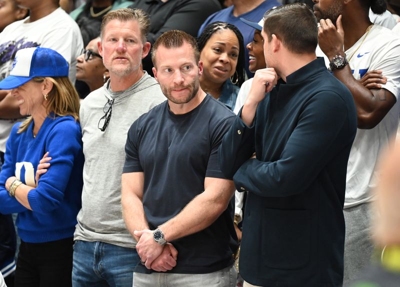 Mar 7, 2026; Durham, North Carolina, USA; Los Angeles Rams general manager Les Snead (left) and head coach Sean McVay (center) look on from behind the Duke Blue Devils bench prior to the second half against the North Carolina Tar Heels at Cameron Indoor Stadium. The Duke Blue Devils won 76-61. Mandatory Credit: Rob Kinnan-Imagn Images