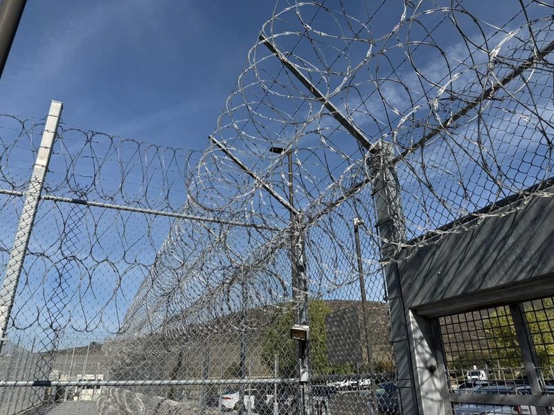 Security fencing is seen from inside Otay Mesa Detention Center near San Diego, operated by private prison company CoreCivic. A court-appointed monitor found that another of its sites at California City in Kern County is failing to provide adequate healthcare.