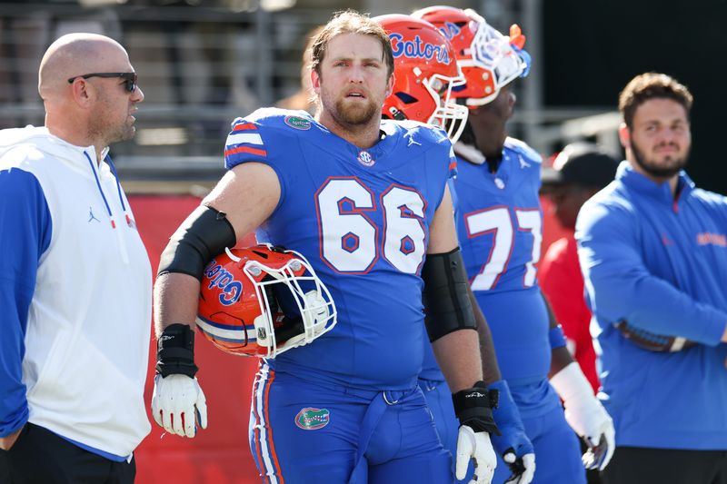 Nov 1, 2025; Jacksonville, Florida, USA; Florida Gators offensive lineman Jake Slaughter (66) looks on during warm ups before the game against the Georgia Bulldogs at EverBank Stadium. Mandatory Credit: Matt Pendleton-Imagn Images