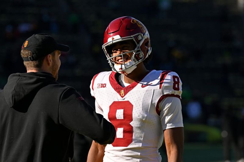 Nov 22, 2025; Eugene, Oregon, USA; Southern California Trojans wide receiver Ja'Kobi Lane (8) talks to a coach before the game against the Oregon Ducks at Autzen Stadium. Mandatory Credit: Troy Wayrynen-Imagn Images