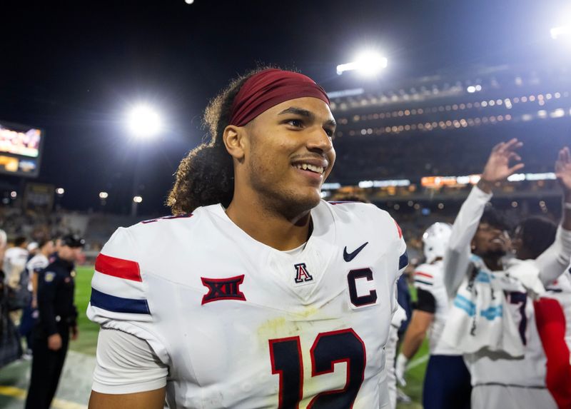 Nov 28, 2025; Tempe, Arizona, USA; Arizona Wildcats defensive back Genesis Smith (12) against the Arizona State Sun Devils during the 99th Territorial Cup at Mountain America Stadium. Mandatory Credit: Mark J. Rebilas-Imagn Images
