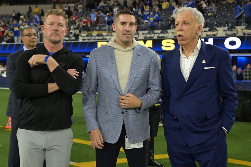 Nov 23, 2025; Inglewood, California, USA; Los Angeles Rams general manager Les Snead, CEO Tony Pastoors and Owner/Chairman Stan Kroenke on the field following the game against the Tampa Bay Buccaneers at SoFi Stadium. Mandatory Credit: Jayne Kamin-Oncea-Imagn Images