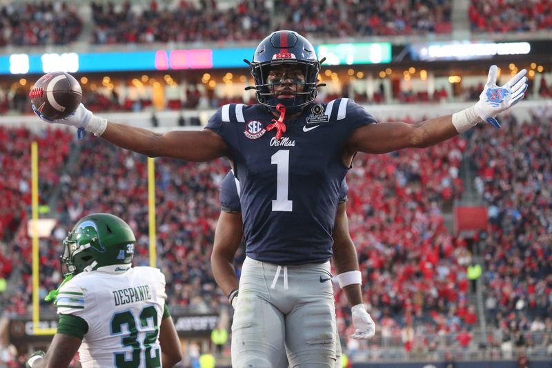 Dec 20, 2025; Oxford, MS, USA; Mississippi Rebels wide receiver De'Zhaun Stribling (1) reacts after catching a touchdown against the Tulane Green Wave during the second half of a game at Vaught-Hemingway Stadium. Mandatory Credit: Petre Thomas-Imagn Images