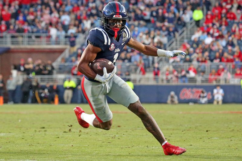 Dec 20, 2025; Oxford, MS, USA; Mississippi Rebels wide receiver De'Zhaun Stribling (1) runs after a catch for a touchdown during the third quarter against the Tulane Green Wave at Vaught-Hemingway Stadium. Mandatory Credit: Petre Thomas-Imagn Images