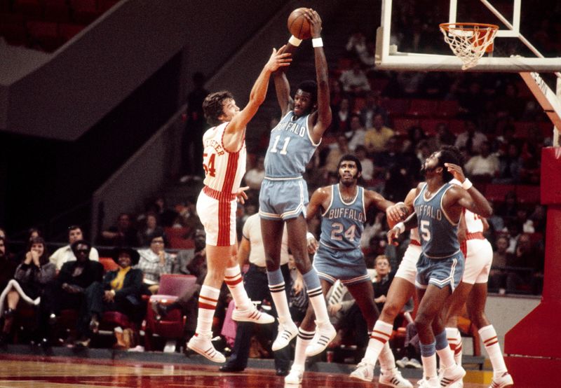 Dec. 11, 1973; Atlanta, GA, USA; FILE PHOTO; Buffalo Braves center Bob McAdoo (11) Atlanta Hawks center Dale Schlueter (54) battle for a rebound during the 1973-74 season at The Omni. Mandatory Credit: Manny Rubio-USA TODAY Sports