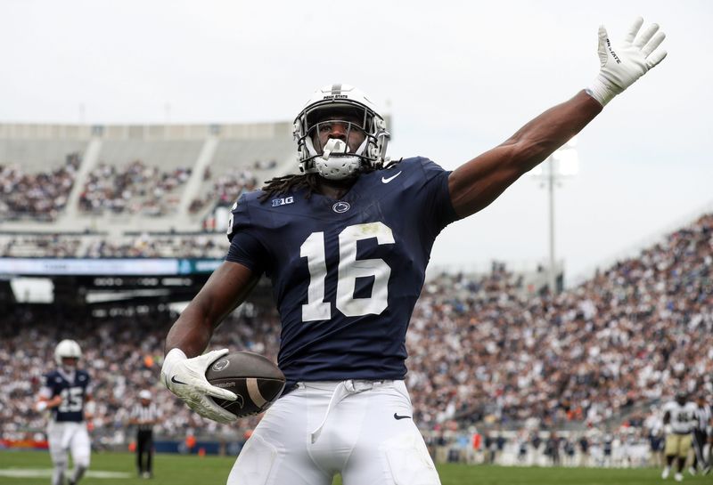 Sep 6, 2025; University Park, Pennsylvania, USA; Penn State Nittany Lions tight end Khalil Dinkins (16) celebrates in the end zone after scoring a touchdown during the first quarter against the Florida International Panthers at Beaver Stadium. Mandatory Credit: Matthew O'Haren-Imagn Images