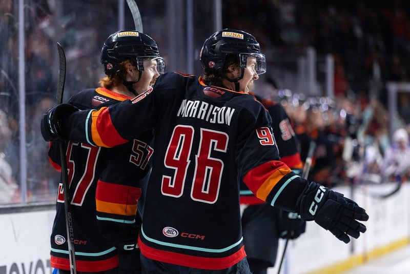 Coachella Valley Firebirds' forwards Jagger Firkus and Logan Morrison celebrate a goal in the second period of the team's win over the Bakersfield Condors on April 26, 2026 inside Acrisure Arena in Palm Desert, California.