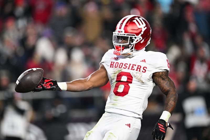 Nov 28, 2025; West Lafayette, Indiana, USA; Indiana Hoosiers running back Kaelon Black (8) celebrates after scoring a touchdown during the second quarter against the Purdue Boilermakers at Ross-Ade Stadium. Mandatory Credit: Marc Lebryk-Imagn Images