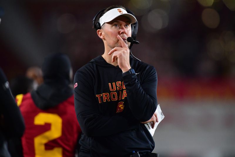 Nov 7, 2025; Los Angeles, California, USA; Southern California Trojans head coach Lincoln Riley watches game action against the Northwestern Wildcats during the second half at the Los Angeles Memorial Coliseum. Mandatory Credit: Gary A. Vasquez-Imagn Images