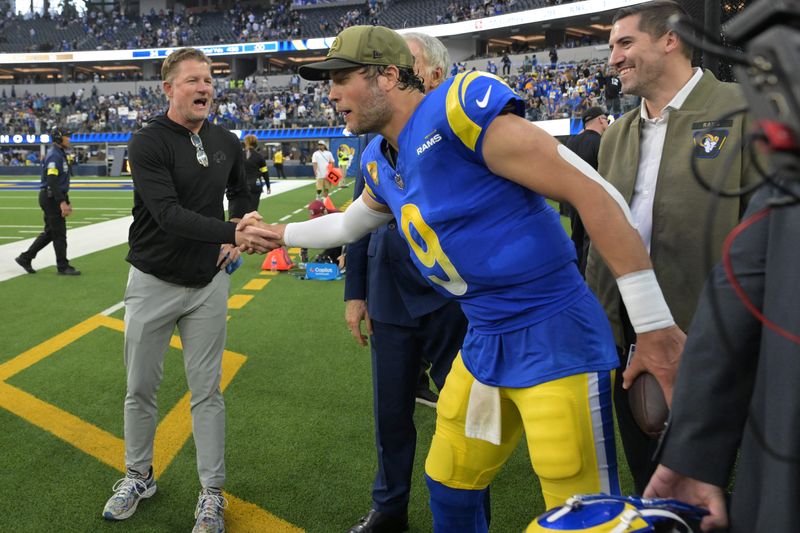 Nov 2, 2025; Inglewood, California, USA; 
Les Snead, general manager of the Los Angeles Rams shakes the hand of quarterback Matthew Stafford (9) following a game against the New Orleans Saints at SoFi Stadium. Mandatory Credit: Jayne Kamin-Oncea-Imagn Images