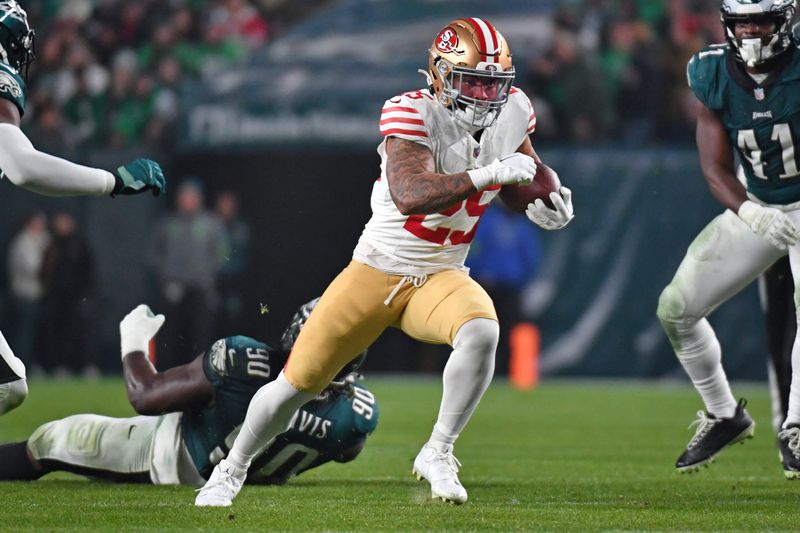Dec 3, 2023; Philadelphia, Pennsylvania, USA; San Francisco 49ers running back Elijah Mitchell (25) runs against the Philadelphia Eagles at Lincoln Financial Field. Mandatory Credit: Eric Hartline-USA TODAY Sports