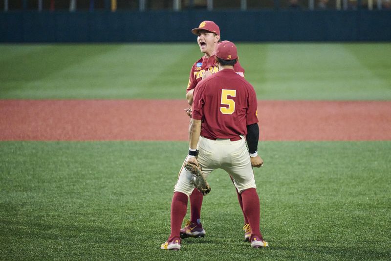 May 31, 2025; Corvallis, OR, USA; USC infielder Ethan Hedges (15) and infielder Adrian Lopez (5) celebrate after beating Saint Mary's at the NCAA Corvallis Regional at Goss Stadium. Mandatory Credit: Troy Wayrynen-Imagn Images