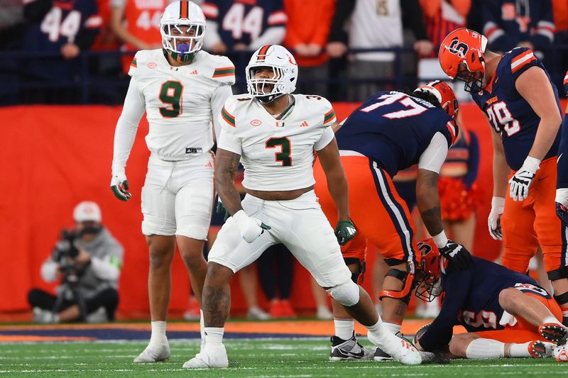 Nov 30, 2024; Syracuse, New York, USA; Miami Hurricanes defensive lineman Akheem Mesidor (3) reacts after a play against the Syracuse Orange during the first half at the JMA Wireless Dome. Mandatory Credit: Rich Barnes-Imagn Images