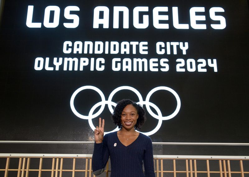 May 11, 2017; Los Angeles, CA, USA; Allyson Felix poses with the Fight On symbol at the Annenberg School for Communication and Journalism on the campus of the University of Southern California. The building is the proposed media center for the 2024 Los Angeles Olympic Games. Mandatory Credit: Kirby Lee-USA TODAY Sports