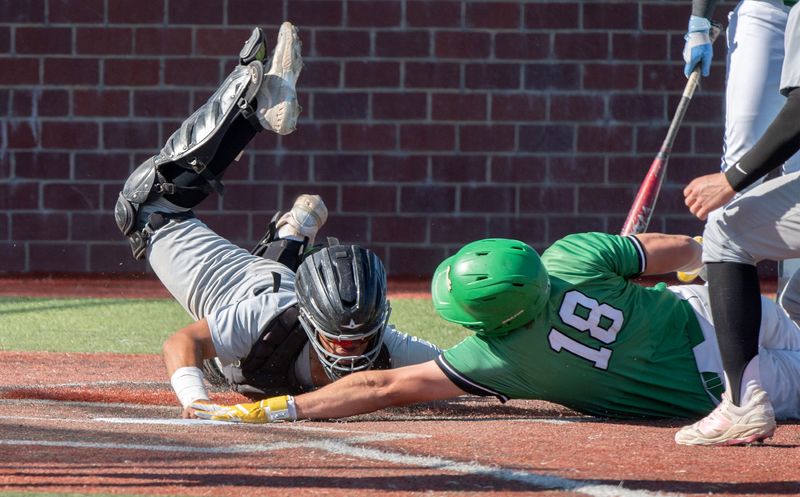 St. Mary’s Dax Hardcastle, right, stretches for home plate as Lincoln’s Colin Stedtfeld dives for the tag during a varsity baseball game at St. Marys High in Stockton on Apr. 29, 2026. Hardcastle was safe on the play and scored a run. St. Mary’s won 4-0.