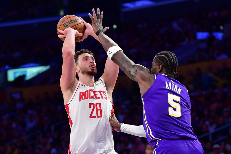 Apr 29, 2026; Los Angeles, California, USA; Houston Rockets center Alperen Sengun (28) shoots against Los Angeles Lakers center Deandre Ayton (5) during the second half in game five of the first round of the 2026 NBA Playoffs at Crypto.com Arena. Mandatory Credit: Gary A. Vasquez-Imagn Images