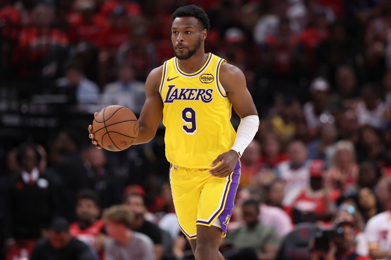 Apr 24, 2026; Houston, Texas, USA; Los Angeles Lakers guard Bronny James (9) dribbles the ball during the fourth quarter against the Houston Rockets during game three of the first round of the 2026 NBA Playoffs at Toyota Center. Mandatory Credit: Troy Taormina-Imagn Images