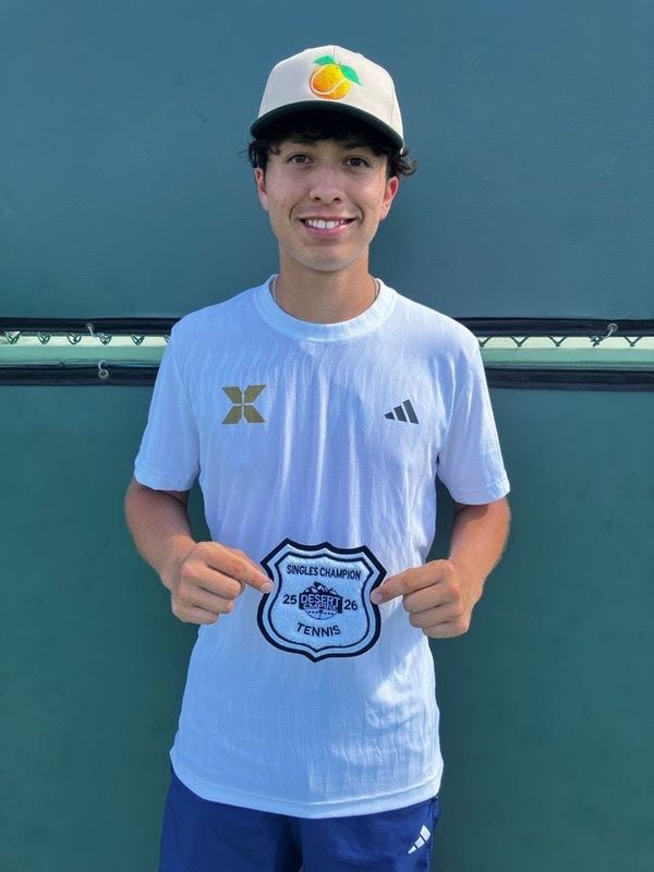 Axel Alverdin of Xavier Prep holds up the patch for winning the Desert Empire League boys' tennis championship on Wednesday, April 29, 2026.