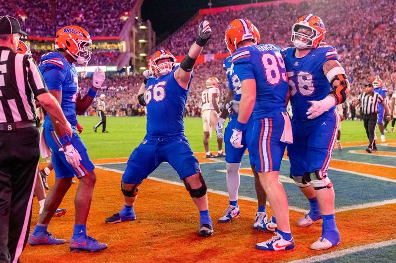 Nov 29, 2025; Gainesville, Florida, USA; Florida Gators center Jake Slaughter (66) celebrates a touchdown during the third quarter against the Florida State Seminoles at Ben Hill Griffin Stadium. Mandatory Credit: Bob Kupbens-Imagn Images