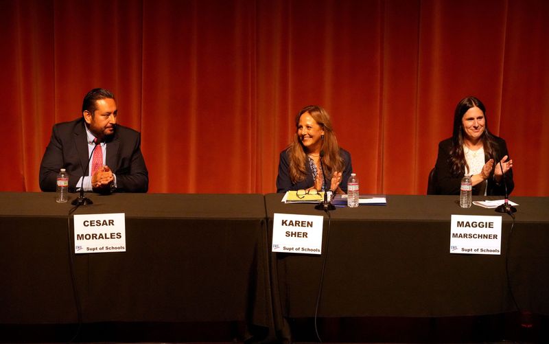 From left, incumbent César Morales, Ventura County Superintendent of Schools, Oxnard Union High School District Board President Karen Sher and educator Maggie Marschner prepare to debate at the Thousand Oaks Civic Arts Plaza's Scherr Forum Theatre on April 30, 2026.