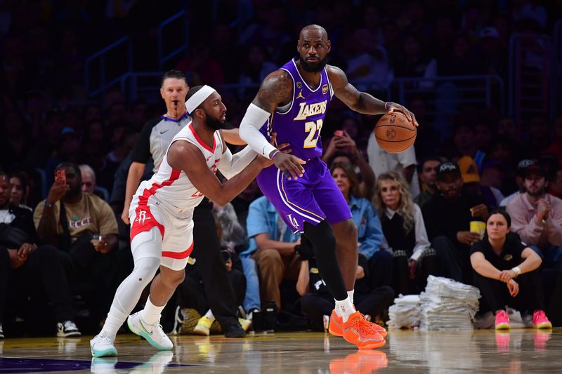 Apr 29, 2026; Los Angeles, California, USA; Los Angeles Lakers forward LeBron James (23) moves the ball against Houston Rockets guard Josh Okogie (20) during the second half in game five of the first round of the 2026 NBA Playoffs at Crypto.com Arena. Mandatory Credit: Gary A. Vasquez-Imagn Images