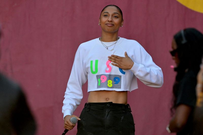 Oct 11, 2025; Los Angeles, California, USA; USC Trojans basketball player JuJu Watkins was on hand as she was named the tunnel captain the the game against the Michigan Wolverines at United Airlines Field at the Los Angeles Memorial Coliseum. Mandatory Credit: Jayne Kamin-Oncea-Imagn Images