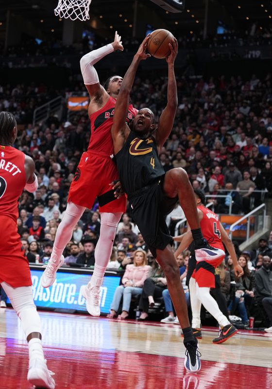May 1, 2026; Toronto, Ontario, CAN; Cleveland Cavaliers center Evan Mobley (4) drives to the basket as Toronto Raptors forward Collin Murray-Boyles (12) tries to defend during the fourth quarter in game six of the first round of the 2026 NBA Playoffs at Scotiabank Arena. Mandatory Credit: Nick Turchiaro-Imagn Images