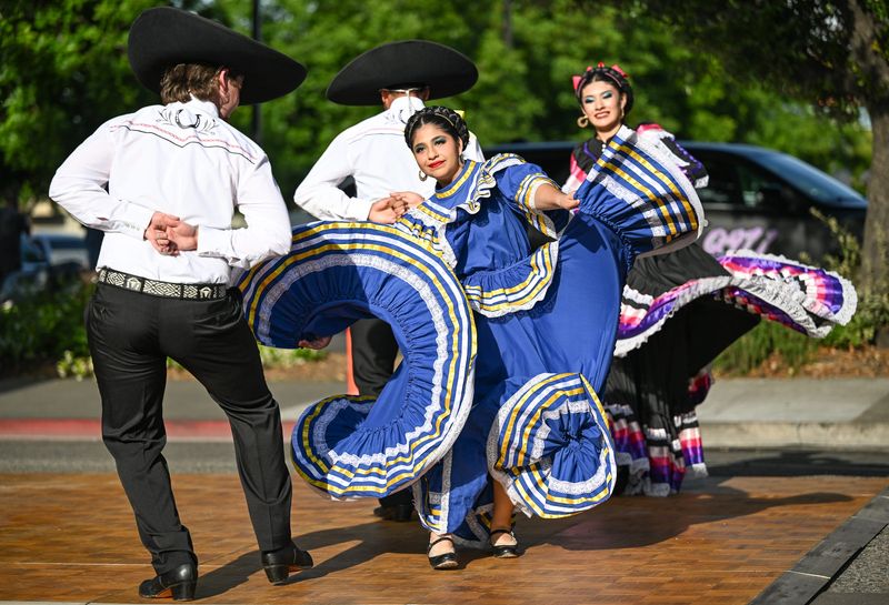 Members of Ballet Folklorico Sierra Linda perform as hundreds celebrate Cinco de Mayo on Friday, May 1, 2026 in Downtown Visalia. The event was sponsored by the Tulare Kings Hispanic Chamber of Commerce.
