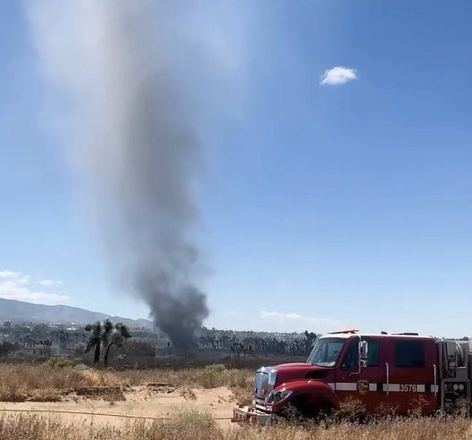 A rare fire phenomenon known as an ash devil appeared as firefighters battled the Trinity Fire in Phelan on Friday, May1 , 2026.