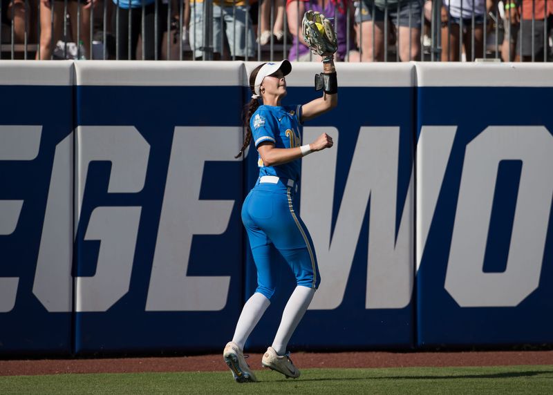 Jun 1, 2025; Oklahoma City, OK, USA; UCLA Bruins outfielder Rylee Slimp (29) makes a catch for an out in the eighth inning against the Tennessee Lady Volunteers during the NCAA Softball Women's College World Series at Devon Park. Mandatory Credit: Brett Rojo-Imagn Images