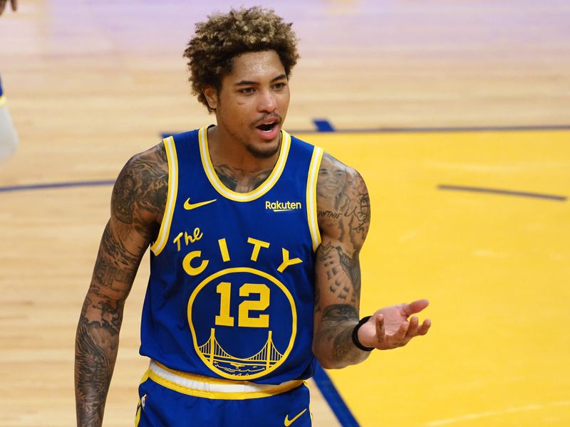 Mar 14, 2021; San Francisco, California, USA; Golden State Warriors forward-guard Kelly Oubre Jr. (12) reacts after being called for a foul against the Utah Jazz during the fourth quarter at Chase Center. Mandatory Credit: Kelley L Cox-USA TODAY Sports