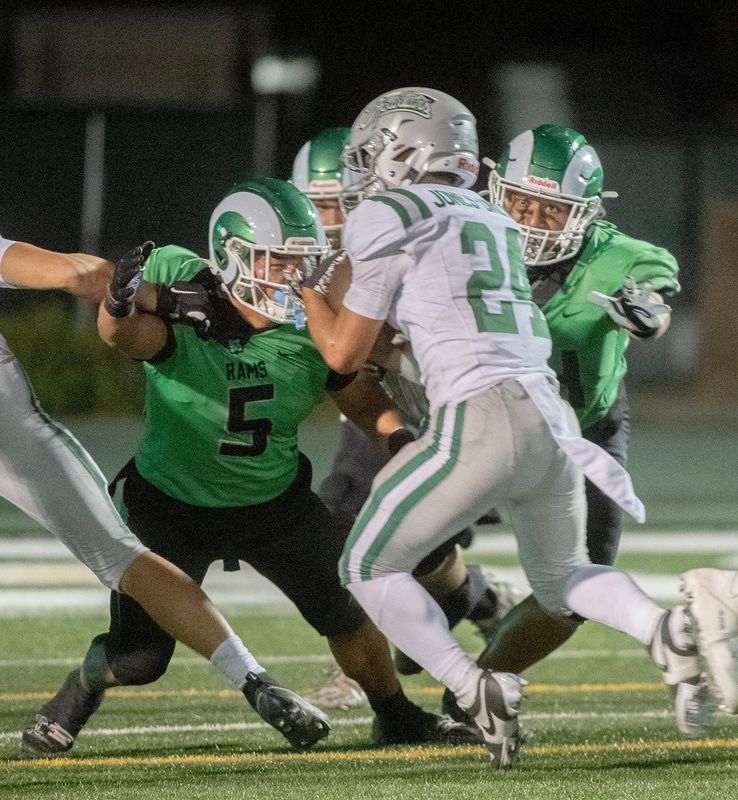 St. Maryâ€™s Diego Hernandez, left, and Malakai Maka close in on De Las Salleâ€™s Duece Jones-Drew during a during a varsity football game at St. Maryâ€™s in Stockton on Sep. 20, 2024. De La Salle won 38-35.