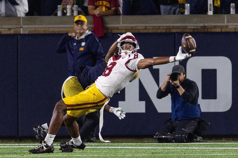 Oct 18, 2025; South Bend, Indiana, USA; Southern California Trojans wide receiver Ja'Kobi Lane (8) attempts to catch the ball in the first half against the Notre Dame Fighting Irish at Notre Dame Stadium. Mandatory Credit: Trevor Ruszkowski-Imagn Images