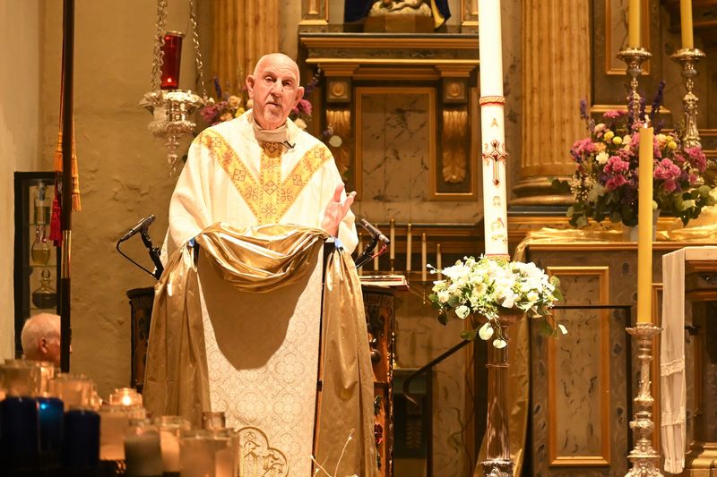 The Rev. Tom Elewaut celebrates Mass at Mission Basilica San Buenaventura on May 4. Elewaut will retire as mission pastor on July 1.
