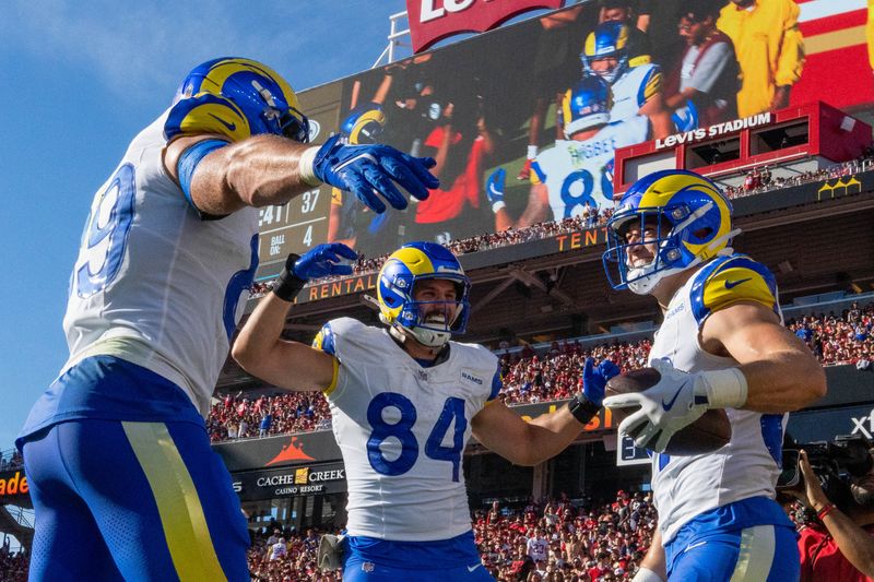 November 9, 2025; Santa Clara, California, USA; Los Angeles Rams wide receiver Xavier Smith (19), tight end Colby Parkinson (84), and tight end Davis Allen (87) celebrate after a touchdown during the second quarter against the San Francisco 49ers at Levi's Stadium. Mandatory Credit: Kyle Terada-Imagn Images