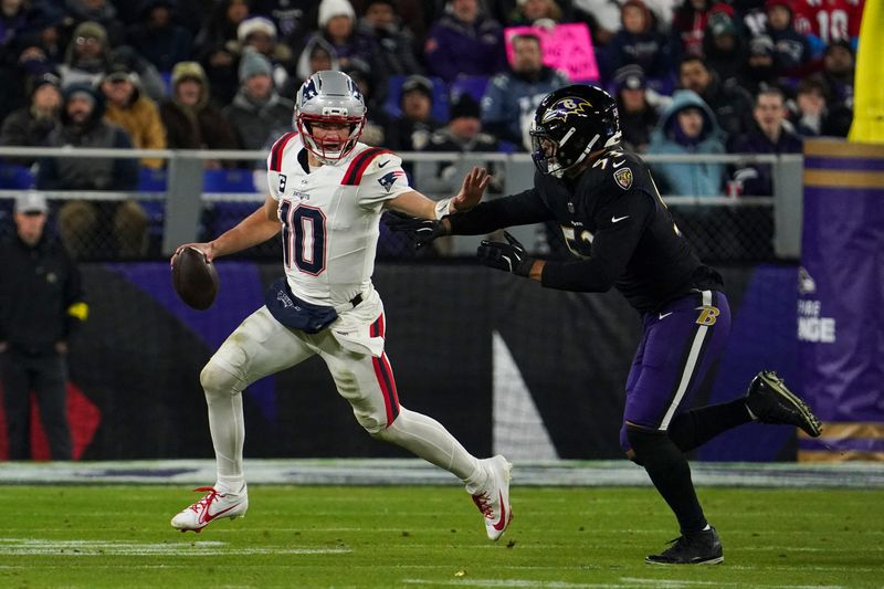 Dec 21, 2025; Baltimore, Maryland, USA; New England Patriots quarterback Drake Maye (10) runs from Baltimore Ravens linebacker Kyle van Noy (53) during the first half of the game at M&T Bank Stadium. Mandatory Credit: James Lang-Imagn Images