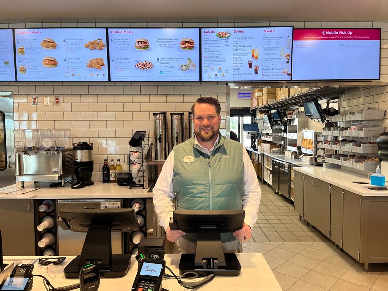 Brett McKinnon, owner/operator of the new Chick-fil-A restaurant in Tulare, is ready to greet customers.