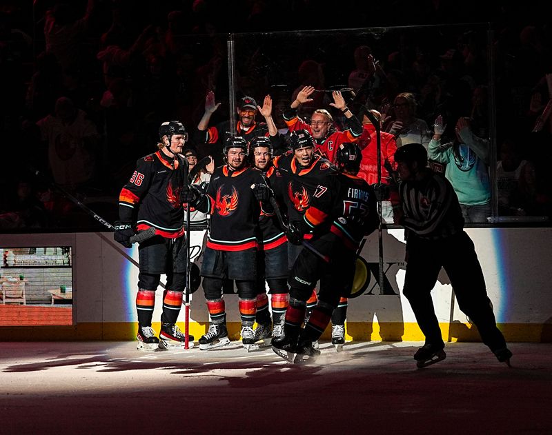 Coachella Valley Firebirds celebrate a goal by Coachella Valley Firebirds forward Jani Nyman (33) and assisted by Coachella Valley Firebirds forward Jagger Firkus (57) during the first period of Game 3 of the second round of the Calder Cup playoffs at Acrisure Arena in Palm Desert, Calif., Tuesday, May 5, 2026.