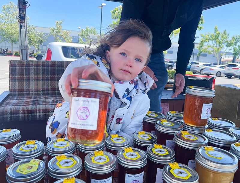 Phoenix helps her dad, Tim Lund, sell pure raw honey at various locations in the High Desert. The Lund Family Hive is located in Hesperia.