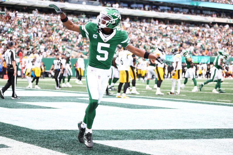 Sep 7, 2025; East Rutherford, New Jersey, USA; New York Jets wide receiver Garrett Wilson (5) celebrates during the second half against the Pittsburgh Steelers at MetLife Stadium. Mandatory Credit: Wendell Cruz-Imagn Images