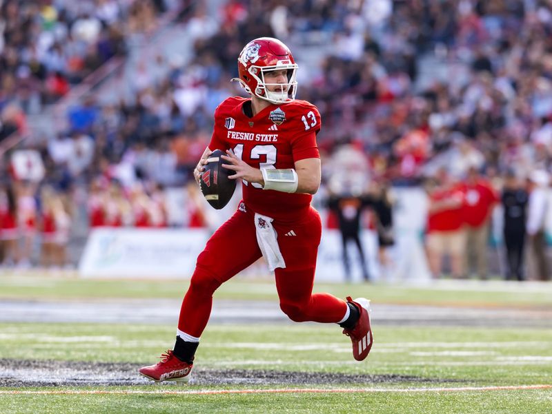 Dec 27, 2025; Tucson, AZ, USA; Fresno State Bulldogs quarterback E.J. Warner (13) against the Miami (OH) RedHawks during the Snoop Dogg Arizona Bowl at Casino Del Sol Stadium. Mandatory Credit: Mark J. Rebilas-Imagn Images