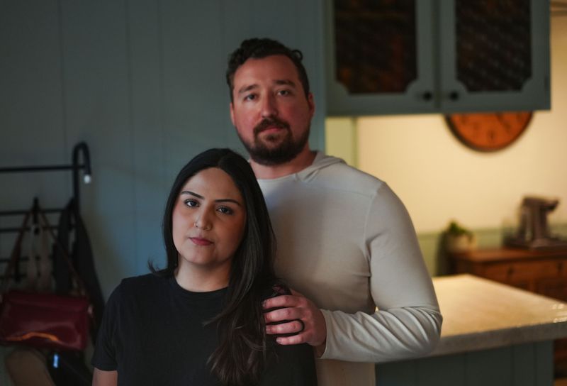 Milena Araya-Davis and her husband Matthew Davis at home a few months after her arrest by ICE threatened to upend their lives.