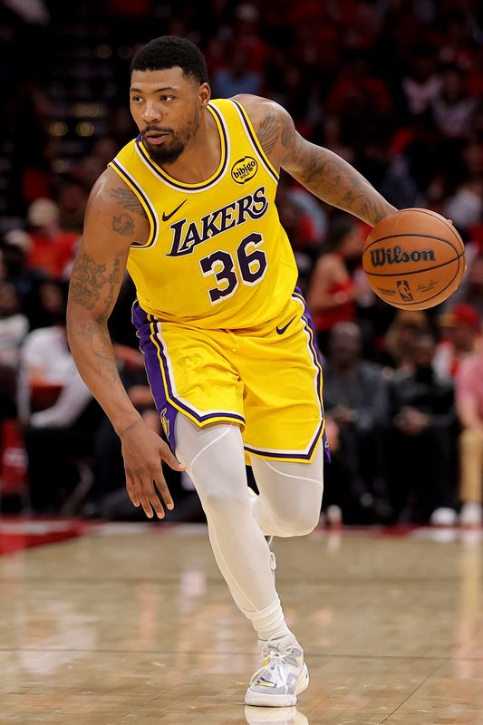May 1, 2026; Houston, Texas, USA; Los Angeles Lakers guard Marcus Smart (36) handles the ball against the Houston Rockets during the fourth quarter of game six of the first round of the 2026 NBA Playoffs at Toyota Center. Mandatory Credit: Erik Williams-Imagn Images