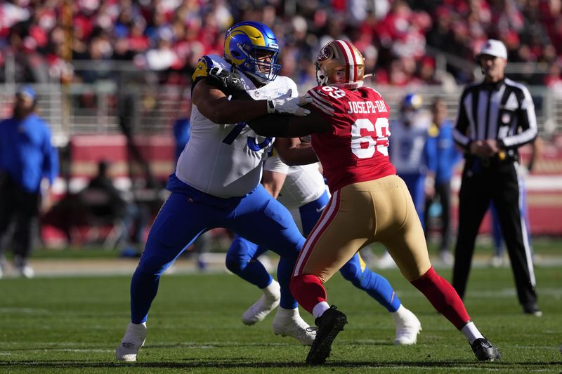 Jan 7, 2024; Santa Clara, California, USA; Los Angeles Rams offensive tackle Rob Havenstein (left) blocks San Francisco 49ers defensive tackle Sebastian Joseph-Day (69) during the first quarter at Levi's Stadium. Mandatory Credit: Darren Yamashita-USA TODAY Sports