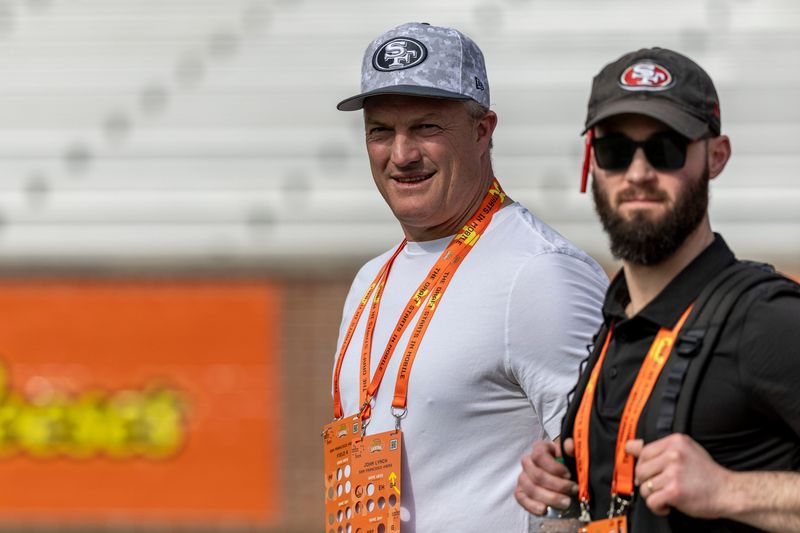 Jan 29, 2025; Mobile, AL, USA; San Francisco 49ers general manager John Lynch watches drills with San Francisco 49ers director of player personnel RJ Gillen during Senior Bowl practice for the American team at Hancock Whitney Stadium. Mandatory Credit: Vasha Hunt-Imagn Images
