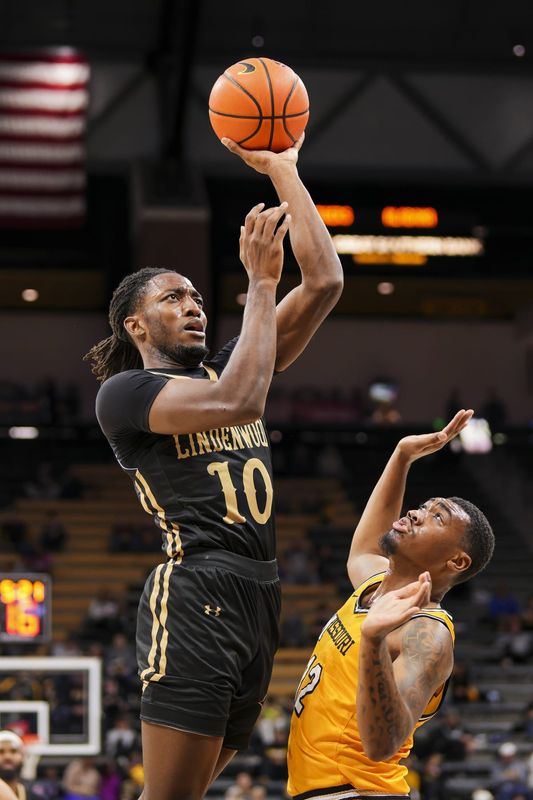 Nov 27, 2024; Columbia, Missouri, USA; Lindenwood Lions guard Jadis Jones (10) shoots the ball against Missouri Tigers guard Tony Perkins (12) during the first half at Mizzou Arena. Mandatory Credit: Jay Biggerstaff-Imagn Images