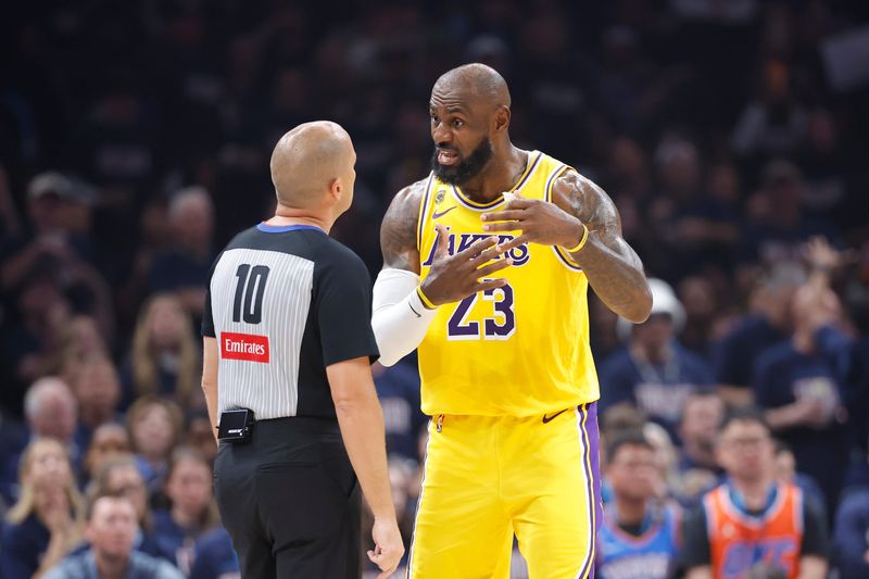May 7, 2026; Oklahoma City, Oklahoma, USA; Los Angeles Lakers forward LeBron James (23) talks to referee John Goble (10) after a play against the Oklahoma City Thunder in the first half during game two of the second round of the 2026 NBA Playoffs at Paycom Center. Mandatory Credit: Alonzo Adams-Imagn Images