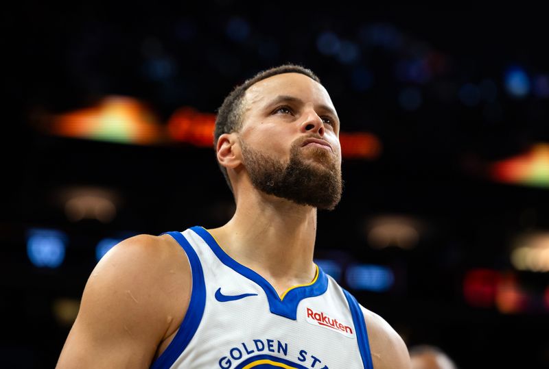 Apr 17, 2026; Phoenix, Arizona, USA; Golden State Warriors guard Stephen Curry (30) reacts after losing to the Phoenix Suns during the play-in rounds of the 2026 NBA Playoffs at Mortgage Matchup Center. Mandatory Credit: Mark J. Rebilas-Imagn Images